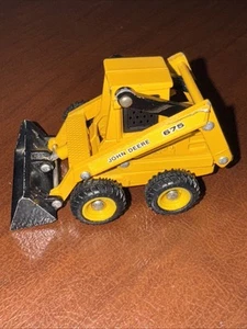 Minicargadora Ertl escala 1/64 John Deere 675, Mighty Movers - Imagen 1 de 5