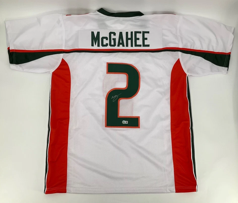 CAMISETA COSIDA BLANCA FIRMADA POR WILLIS MCGAHEE MIAMI HURRICANES CERTIFICADO DE AUTENTICIDAD BECKETT Foto 1 de 3