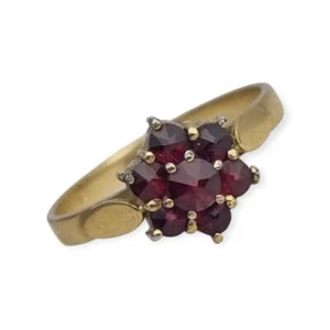 Anillo vintage en plata bañada en oro con granates, diseño rosetón, años 60. - Foto 1 di 10