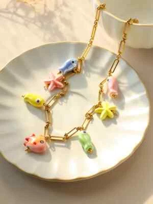 Collar colgante de estrellas de mar y pescado para mujer aspecto cerámico estilo playa Foto 1 de 4