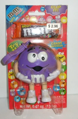 Dispensador de caramelos púrpura Clip It Galerie 2005 M&M's Mini's nuevo sellado Foto 1 de 3