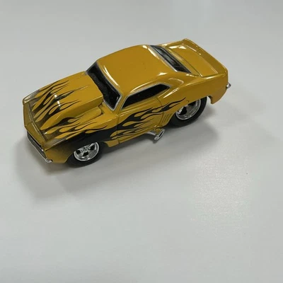 funline muscle machines 69 yellow Camaro 1:64 - Image 1 of 3