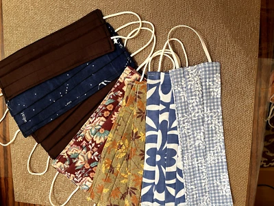 Fabric Masks, handmade, a set of 8, new, never used with elastic. about 3 x 8 in - Image 1 of 4