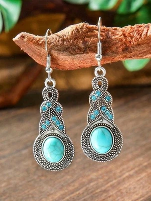 Pendientes colgantes plateados de zinc turquesa con detalles de circonita azul Foto 1 de 4