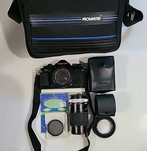 Canon A-1 SLR 35mm Film Camera w/ 2 Lenses & Accessories - Picture 1 of 16