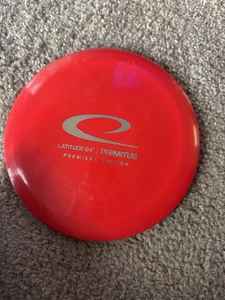 Latitude 64 Premiere Edition Disc Golf Primitus OOP- Red w/ Silver HS - 170-175g - Picture 1 of 1