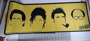 Rare Seinfeld Desk Mat. Color Yellow Large Size 11x31in. Brand New with the Box! - Bild 1 von 5