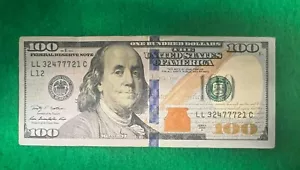 $100 dollar bill Lucky 777 in Serial Number LL 32477721 C - Picture 1 of 7