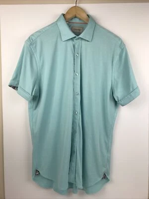 Camisa polo de golf de manga corta con botones turquesa de Williams & Kent para hombre Foto 1 de 4