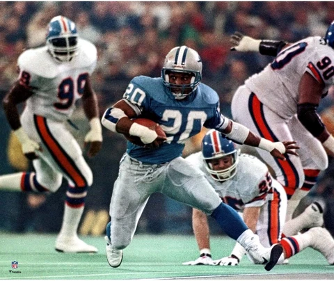 Barry Sanders Detroit Lions Unsigned Blue Jersey Running Photograph Cover