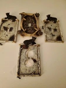 LOT OF (4), DECORATIVE OUTLET COVER PLATES, AND 1 TOGGL PLATE - Picture 1 of 5