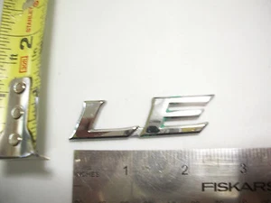 LE LETTERS EMBLEM BAGDE CHROME OEM ORIGINAL - Bild 1 von 1