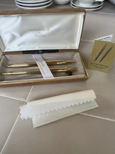 Juego de bolígrafos y lápices vintage tono dorado ASTRAMATIC II de Bradley en estuche de terciopelo. - Imagen 1 de 10