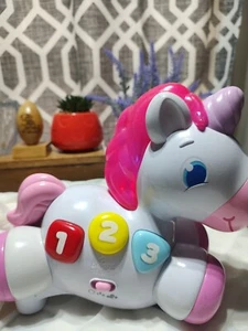 Bright Starts Rock & Glow Unicorn Toy with Lights and Melodies Pink and White - Picture 1 of 6
