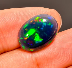 3.5 Ct Natural Black Ethiopian Oval Cabs Opal Fire Play Opal Gemstone 16X11X4 mm - Picture 1 of 4