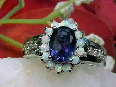 Anillo de compromiso con halo de ópalo de fuego y tanzanita de corte ovalado de 2,40 quilates acabado en oro blanco de 14 quilates Foto 1 de 4