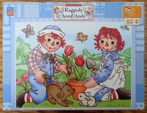 NEW/SEALED MasterPiece 60 Piece Jigsaw Puzzle "Raggedy Ann & Andy Plant Flowers" - Picture 1 of 3