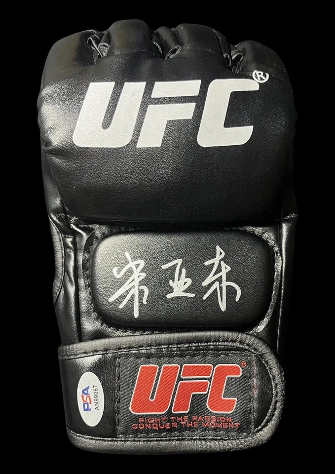 Song Yadong Signed Autographed UFC Glove PSA/DNA Authenticated - Image 1 of 1