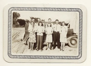 FOUR YOUNG COUPLES POSE IN FRONT OF AN AUTOMOBILE IN TEXAS HILL COUNTRY (1946) - Picture 1 of 3