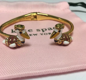Nuevo brazalete bisagra abierta pelícano Taking Flight tono dorado Kate Spade New York - Imagen 1 de 12