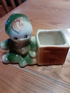 Vintage American Bisque Pottery Little Boy In Green Outfit Brown Lettered Block - Picture 1 of 5