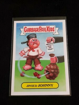 2016 Garbage Pail Kids 7a JINXED JOHNNY American As Apple Pie ICON GPK - Image 1 of 2