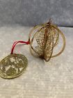 2 brass ornaments. Santa over a rooftop. 6 sided candle. 3D. 3 inch.
