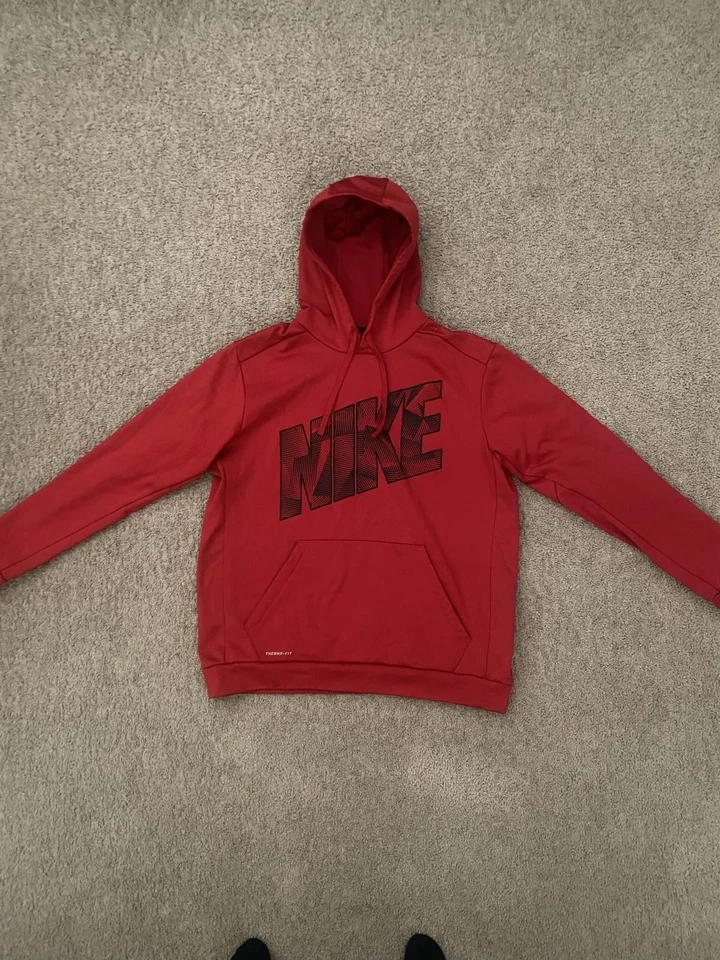 Sudadera con capucha pulóver térmica roja Nike para hombre Foto 1 de 3