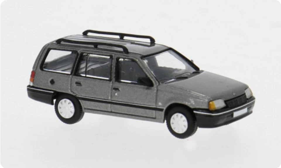 Brekina PCX870498 Opel Kadett E Caravan, Grigio, 1985, H0, Nuovo 2025 - Immagine 1 di 1