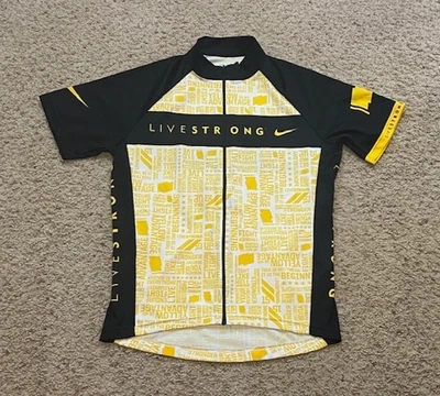 Camiseta deportiva de ciclismo Nike Livestrong negra amarilla S/S cremallera completa talla mediana M lanza usada en excelente estado Foto 1 de 4