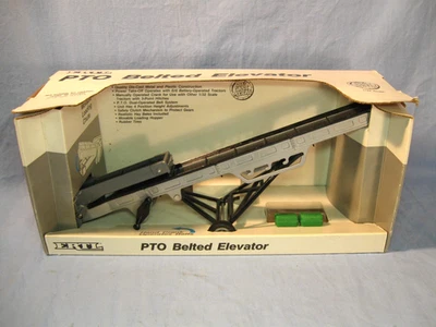 Elevador vintage 1989 ERTL TOMA con cinturón, gris, #4155 y 2 pacas Foto 1 de 4