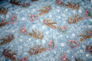 SANTA Y TRINEO VOLANDO ALTO SOBRE AZUL DE HOFFMAN - TELA 100% ALGODÓN - Imagen 1 de 5