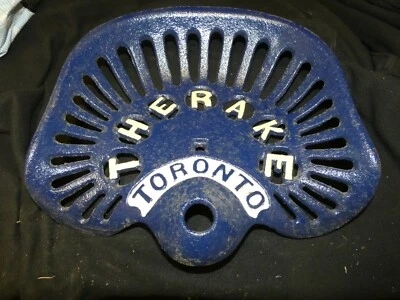 THE  RAKE TORONTO TRACTOR IMPLEMENT  SEAT  FARM  COLLECTABLES CAST IRON FARM - Image 1 of 4