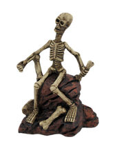 Zeckos Creepy Skeleton Sitting On Rocks Statue Figure