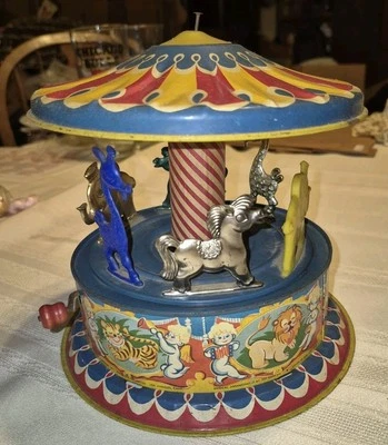 Juguete de cuerda litográfico de hojalata Merry Go Round de circo musical Mattel de colección Foto 1 de 4