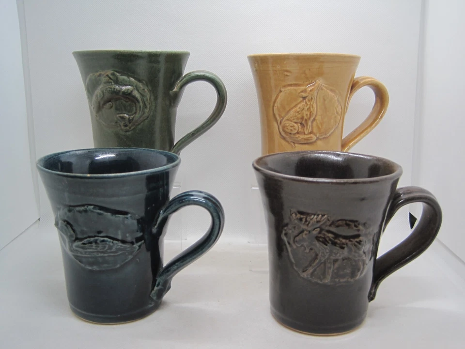 4 Rowe Pottery Works Stoneware Mugs, Moose, Loon, Wolf and Trout - Image 1 of 4