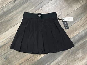 Microfalda de tenis plisada de tiro alto Aritzia TNA negra para mujer talla XS por encima de la mano - Imagen 1 de 4