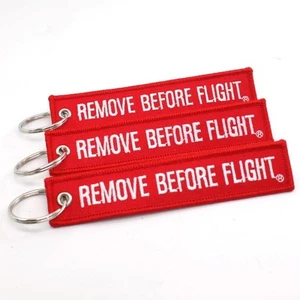 LLAVERO QUITAR ANTES DEL VUELO - ROJO/BLANCO CANTIDAD = 3 ETIQUETAS - LLAVE TRIPULACIÓN PILOTO BANDERA - Imagen 1 de 5