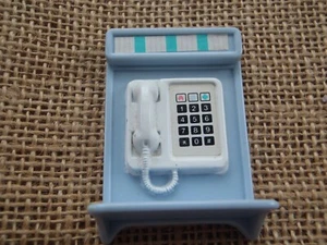 Teléfono de pared azul para casa de muñecas Fisher Price Loving Family - Imagen 1 de 4