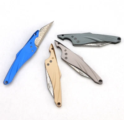 Mini cuchillo de aleación de titanio/aluminio llavero de bolsillo para exteriores cuchillo colgante regalo Foto 1 de 4