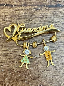 Grandma Vintage K.I.S Signed Gold Tone Brooch Pin 2 Charms Boy Girl Rhinestones - Picture 1 of 8