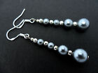 A PAIR OF SILVER GREY  PEARL EARRINGS WITH 925 SOLID SILVER HOOKS. NEW.. 