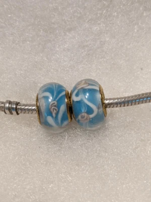 Juego de 2 NUEVO Pandora Transparente Azul y Profundamente incrustado Rosa Flores y Blanco Swi Foto 1 de 2