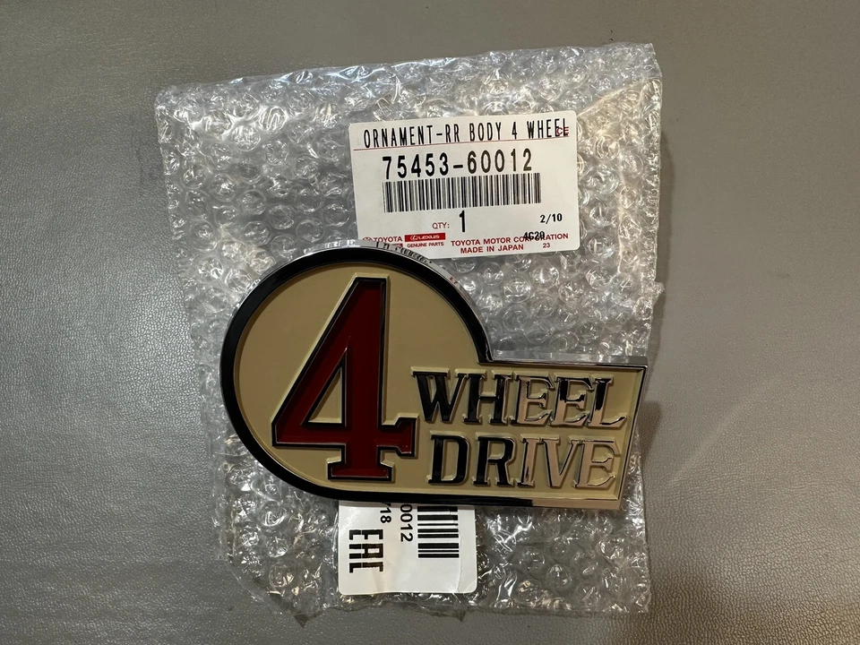 Genuine Toyota Land Cruiser Rear 4WD Emblem. 75453-60012 - Image 1 of 1