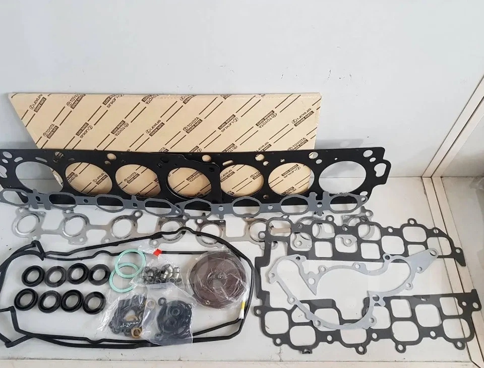 Kit de juntas de motor TOYOTA genuino Land Cruiser UZJ100 2UZFE 04111-50410 Foto 1 de 1