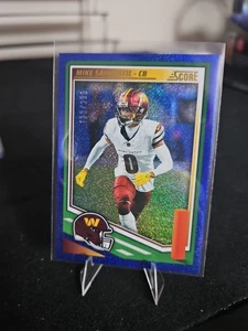 2025 Score Blue Prizm Mike Sainristil /399 - Picture 1 of 4