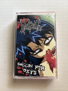 Vomitoma \ Beggin For Oxys – Split Cassette Uninvited Records Goregrind - Picture 1 of 3