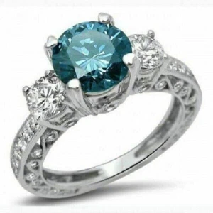 Anillo de compromiso de tres piedras con topacio azul corte redondo de 2,65 quilates acabado en oro blanco de 14 k - Imagen 1 de 1