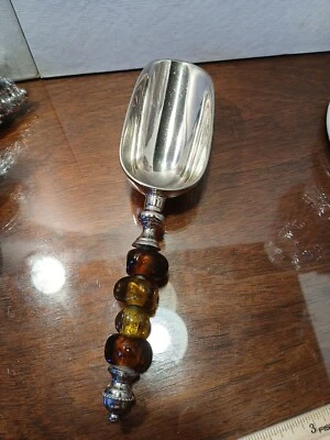 Cuchara de caramelo con mango de cuentas ámbar de vidrio metal tono plata Foto 1 de 4
