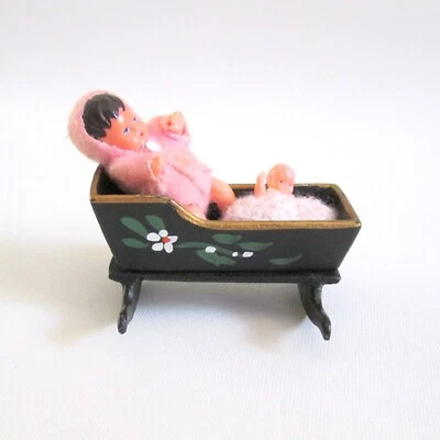 Vintage Cast Iron Miniature Cradle With 2 Mini Baby Dolls Hand Painted 3 1/2" - Image 1 of 4